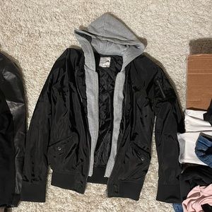 Black Bomber jacket with grey hoodie sewn in